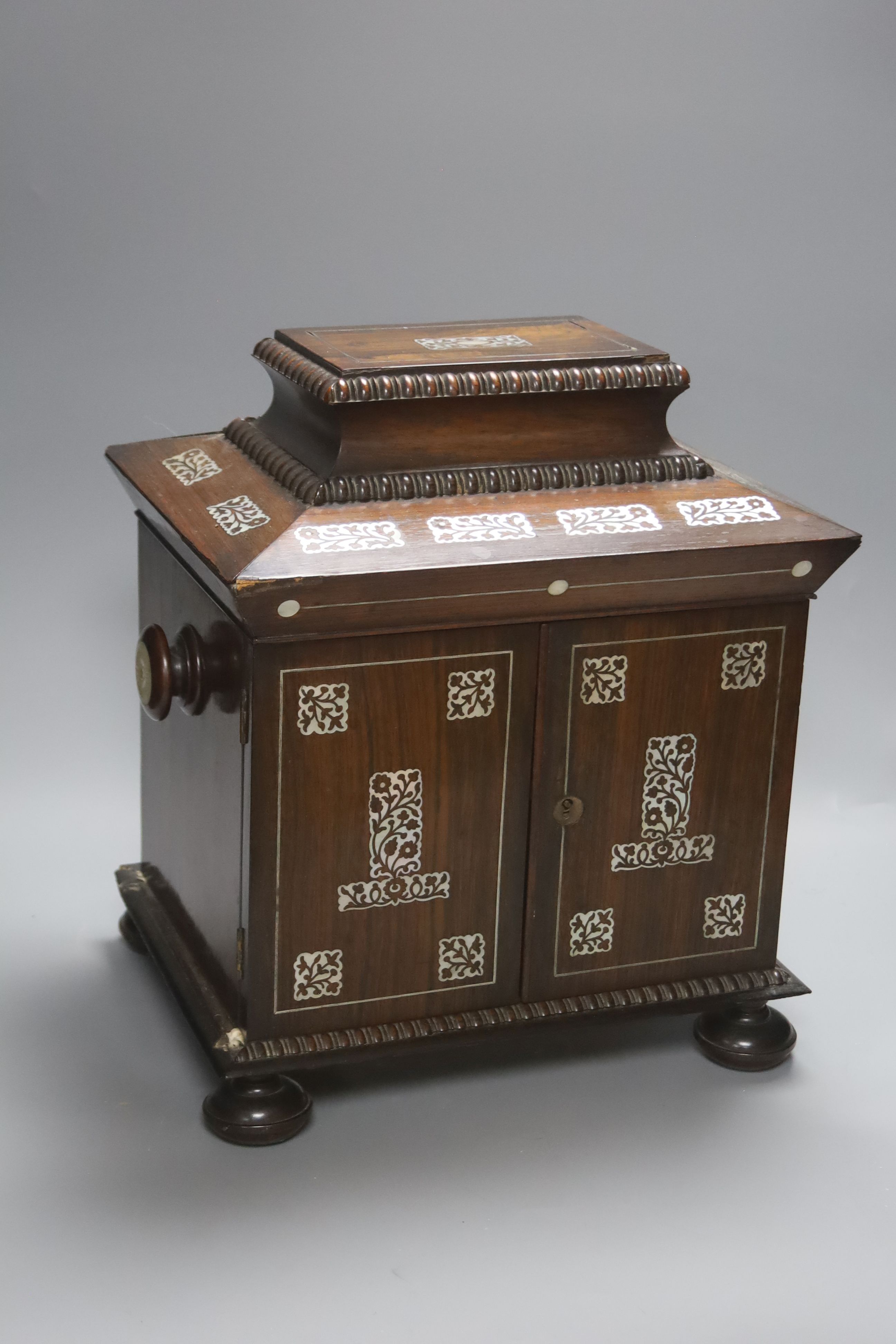 A William IV mother of pearl inset rosewood work box, height 36cm, containing mother-of-pearl and ivory items